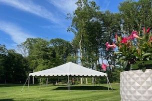 Family enjoying outdoor meal and drinks in the garden.